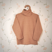 Load image into Gallery viewer, Camel Brown, Tan turtle neck hanging on a hanger. Gender Neutral long sleeve organic pakucho cotton top.
