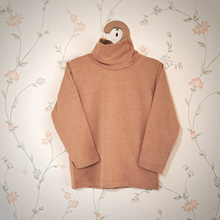 Load image into Gallery viewer, Camel Brown, Tan turtle neck hanging on a hanger. Gender Neutral long sleeve organic pakucho cotton top.