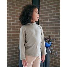 Load image into Gallery viewer, Green avocado turtle neck on boy. Gender Neutral long sleeve organic pakucho cotton top.