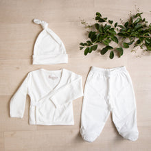 Load image into Gallery viewer, White organic cotton baby outfit. Hello baby organic pima cotton gift set.  Body suit long sleeve wrap top kimono footed pants knotted hat that goes in Organic Pima Cotton Baby gift box set bundle present baby shower hat kimono side snap top footed pants. Long Sleeve Bodysuit GOTS certified snap buttons handmade in Peru for Pan American Apparel in Ecowhite white newborn 0 to 3 months.