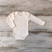 Load image into Gallery viewer, Organic Pima Cotton Baby Long Sleeve single picture of flat ecowhite white Bodysuit GOTS certified snap buttons handmade in Peru for Pan American Apparel in Ecowhite and soft pink for newborn 0 to 3 months 3 to 6 months 6 to 9 months 9 to 12 months 12 to 18 months