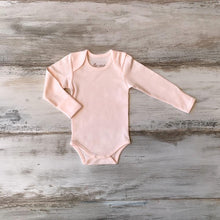 Load image into Gallery viewer, Organic Pima Cotton Baby Long Sleeve single picture of flat soft pink Bodysuit GOTS certified snap buttons handmade in Peru for Pan American Apparel in Ecowhite and soft pink for newborn 0 to 3 months 3 to 6 months 6 to 9 months 9 to 12 months 12 to 18 months