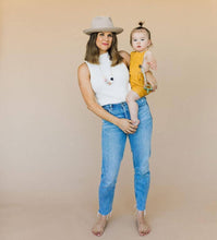 Load image into Gallery viewer, Mom holding her baby mom is wearing Audrey Chewable silicone necklace in five colors tan brown green gray pink white black with satin string for teething baby