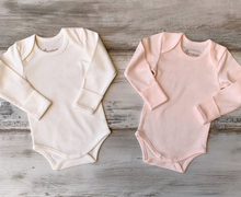 Load image into Gallery viewer, Organic Pima Cotton Baby Long Sleeve Bodysuit GOTS certified snap buttons handmade in Peru for Pan American Apparel in Ecowhite and soft pink for newborn 0 to 3 months 3 to 6 months 6 to 9 months 9 to 12 months 12 to 18 months