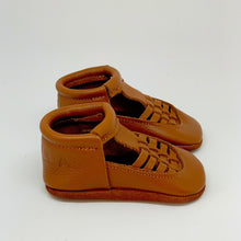 Load image into Gallery viewer, side shot of Soft Sole leather flexible handmade baby and toddler shoes moccs moccasins made in Peru genuine leather wide foot barefoot like shoes slip on feet sandal spring summer brown caramel neutral unisex