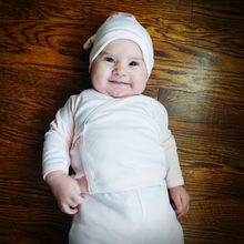 Load image into Gallery viewer, Baby model Willa, wearing the Organic Pima Cotton Hello Baby box set bundle. present baby shower gift. hat, kimono side snap top, footed pant, and Long Sleeve Bodysuit GOTS certified snap buttons handmade in Peru for Pan American Apparel in Ecowhite white for newborn 0 to 3 months