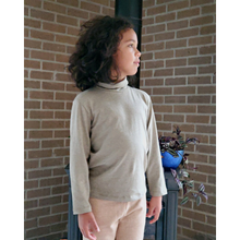 Load image into Gallery viewer, Green avocado turtle neck on boy. Gender Neutral long sleeve organic pakucho cotton top.
