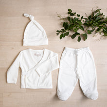 Load image into Gallery viewer, White organic cotton baby outfit. Hello baby organic pima cotton gift set.  Body suit long sleeve wrap top kimono footed pants knotted hat that goes in Organic Pima Cotton Baby gift box set bundle present baby shower hat kimono side snap top footed pants. Long Sleeve Bodysuit GOTS certified snap buttons handmade in Peru for Pan American Apparel in Ecowhite white newborn 0 to 3 months.
