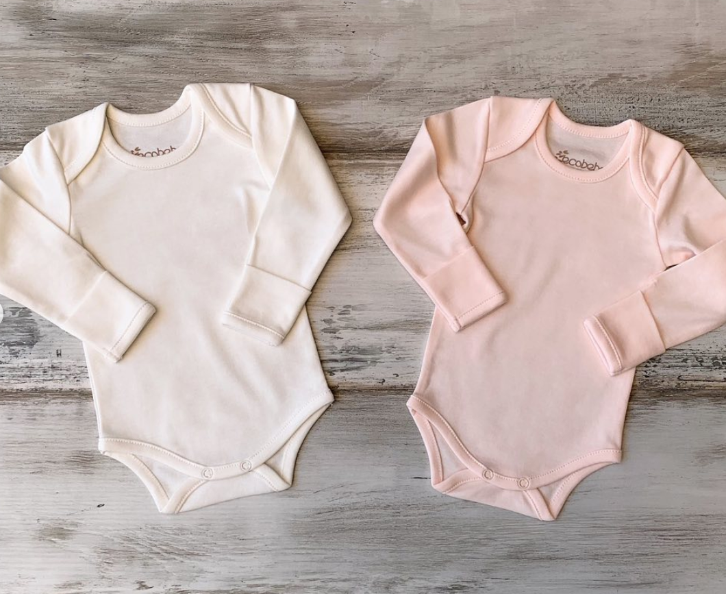 Organic Pima Cotton Baby Long Sleeve Bodysuit GOTS certified snap buttons handmade in Peru for Pan American Apparel in Ecowhite and soft pink for newborn 0 to 3 months 3 to 6 months 6 to 9 months 9 to 12 months 12 to 18 months 