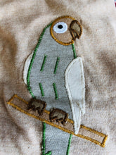 Load image into Gallery viewer, Organic Peruvian Native Cotton Tee with Parrot Embroidery Stitch Applique for Kids Hypoallergenic Brown Gender Neutral handmade for Pan American Apparel eco-friendly slow fashion Pakucho cotton short sleeves close up of parrot 
